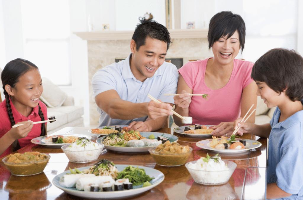 Vietnamese family enjoying a meal at home